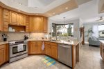 Kitchen with Great Views of Living Room and Pool Area