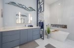 Main Bathroom with Garden Tub and Walk in Shower Featuring Dual Sinks