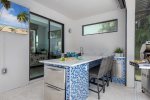 Outdoor Bar with Fridge and Sink as well as Bar and Bar Stools