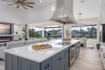 Kitchen with Oversized Island and Views of the Canal and Pool