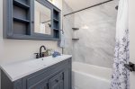 Hallway Bathroom with Shower/Tub Combo and Sink Shared by Queen and Twin Bedroom