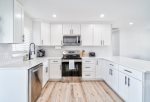 Kitchen with Stainless Appliances and View of the Patio