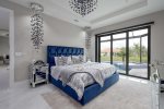 Main King Bedroom with Views of the Pool and Access to the Lanai