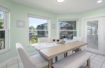 Dining with a View and French Doors Leading to the Pool Area