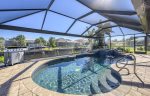 Beautiful Eastern Facing Pool with Waterfall Spill over Spa