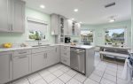 Spacious Kitchen with Views of the Garden and Water