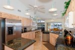 Roomy kitchen with granite counters and stainless steel appliances