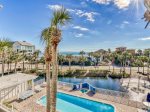 Photo taken from another unit we manage, showing the pool, pond, and beach