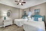 Second bedroom with two full size beds