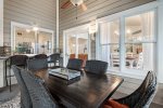 Screened in Porch with a Dining Table and Bench seating
