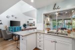 Kitchen with Granite countertops overlooking the Screened in Porch