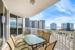 Large balcony with dining table and seating for six