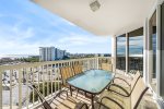 Large balcony with dining table and seating for six