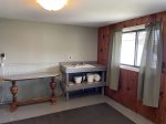 Lower level utility room with door to outside patio.  Perfect for coolers and your water toys.