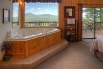 Master bedroom with spa tub and incredible views