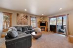 Living room with fireplace and views.