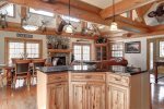 Antler Lodge - Breakfast island , Living room/dinning room with gas fireplace. 