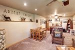 Antler Lodge - Down stairs living room with gas fireplace and foosball. 
