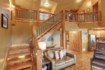 Cloud 9 Cabin living room with beautiful stairs. 
