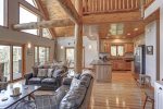 In The Snow Lodge living room with with large windows. 