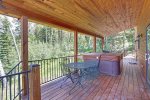 In The Snow Lodge deck with forest views. 