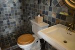 Natural Slate, Walk in Shower, Pedestal Sink and Plush Towels