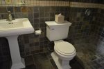 Natural Slate, Walk in Shower, Pedestal Sink and Plush Towels