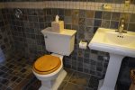 Natural Slate, Walk in Shower, Pedestal Sink and Plush Towels