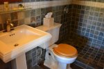 Slate Tiles, Walk in Shower, Pedestal Sink and Plush Towels