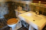 Slate Tiles,  Walk in Shower,  Pedestal Sink and Plush Towels
