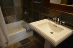 Natural Slate, Walk in Shower, Tub, Pedestal Sink and Plush Towels