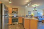 Full-size kitchen within a one bedroom condo in River Run Village