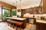 Stone countertops and stainless steel appliances 