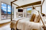 Master bedroom with king bed and fireplace