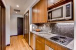 Kitchenette with Small Stovetop in Studio Condo - The Lion Vail 
