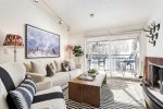 Light and bright living room with wood-burning fireplace