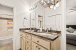 A double vanity and separate tub and shower area provide privacy and comfort for your stay.