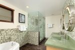 The beautiful tile, double vanity and jacuzzi tub offer a spa-like atmosphere in the master bath.