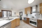 From the kitchen you can enjoy the incredible view of Aspen Mountain through the large windows and sliding glass doors.