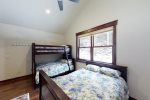 Guest bedroom with full size bed and captain`s bunk twin over full