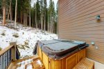 Deck with private hot tub on the back of the home