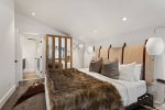 The master bedroom retreat with en-suite bath welcomes you to a wonderful nights rest after a long day exploring Aspen.