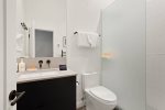 The guest bathroom is located between the twin bedrooms and has a walk in shower, heated floors and towel bar