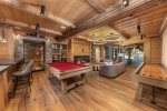 game room with bar and pool table