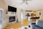 Open living and kitchen area with fireplace