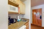 Kitchenette with microwave, fridge, coffeemaker, sink