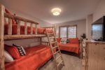 Bunk room with twin bunks, daybed and twin trundle