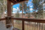 Patio off of living area with forest views