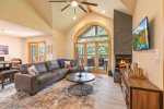 Family room features plenty of seating and card table for entertaining