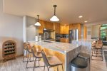 Chef`s kitchen with granite countertops and stainless steel appliances